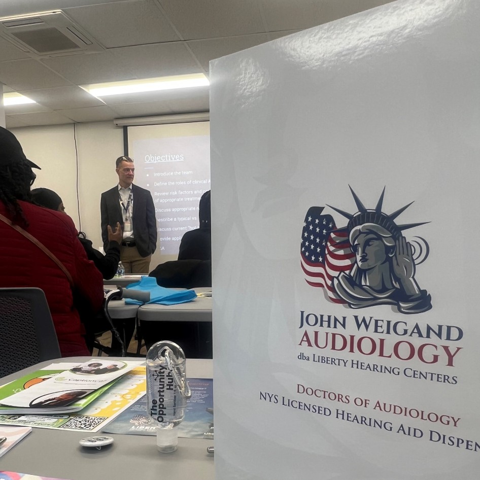 Audiologist John P. Weigand standing