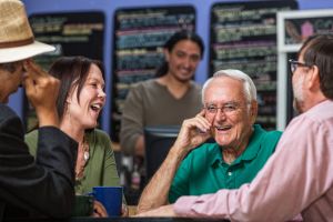 A group of people eat in a noise cafe.