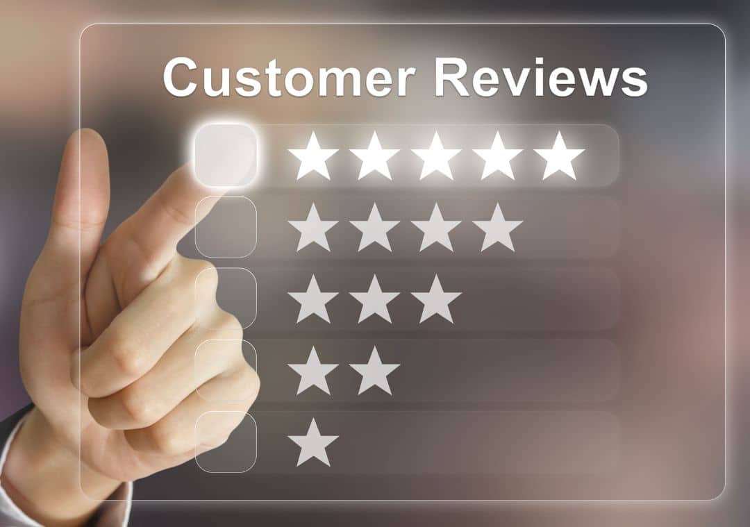 Hand pointing to row of stars for customer reviewss