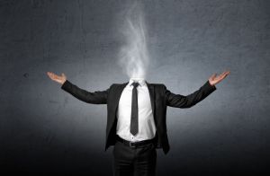 A man whose head has been replaced by fog.