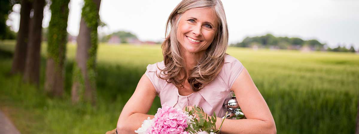 Woman outside with bike