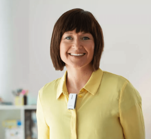 A teacher wearing a remote microphone EduMic.
