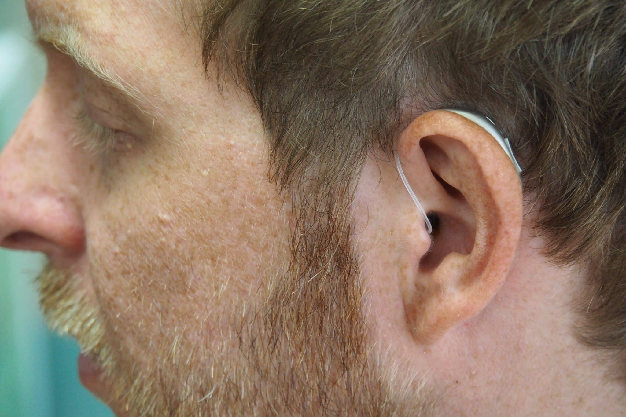 RIC hearing aids on middle-aged man