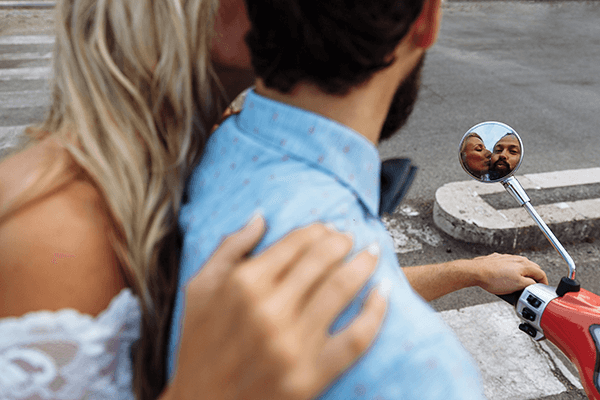Couple Riding Motor Scooter
