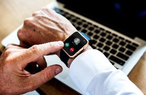 A man answers an incoming call on his Apple Watch.