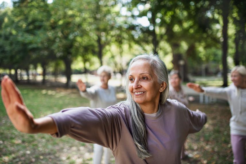 Women doing tai chi outside