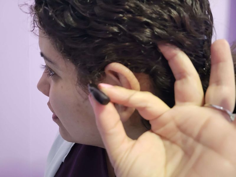 Carmen Cusido's hearing aid, which she wears due to hearing loss from Ramsay Hunt Syndrome.